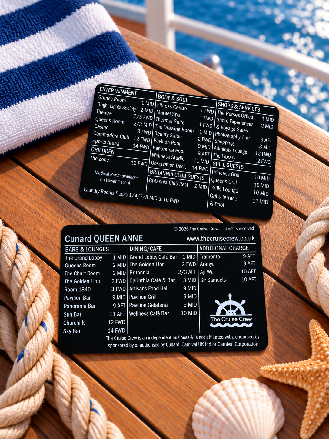 Cruise Crew index card for Cunard Queen Anne, front and back, on a teak deck